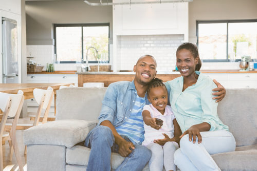 Happy family relaxing on the couch